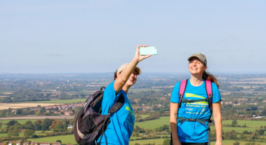 Friends Victoria and Alice stop for a selfie up on the first peak