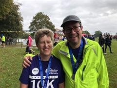 Runners in high vis wearing medals at Herts 10k 2019